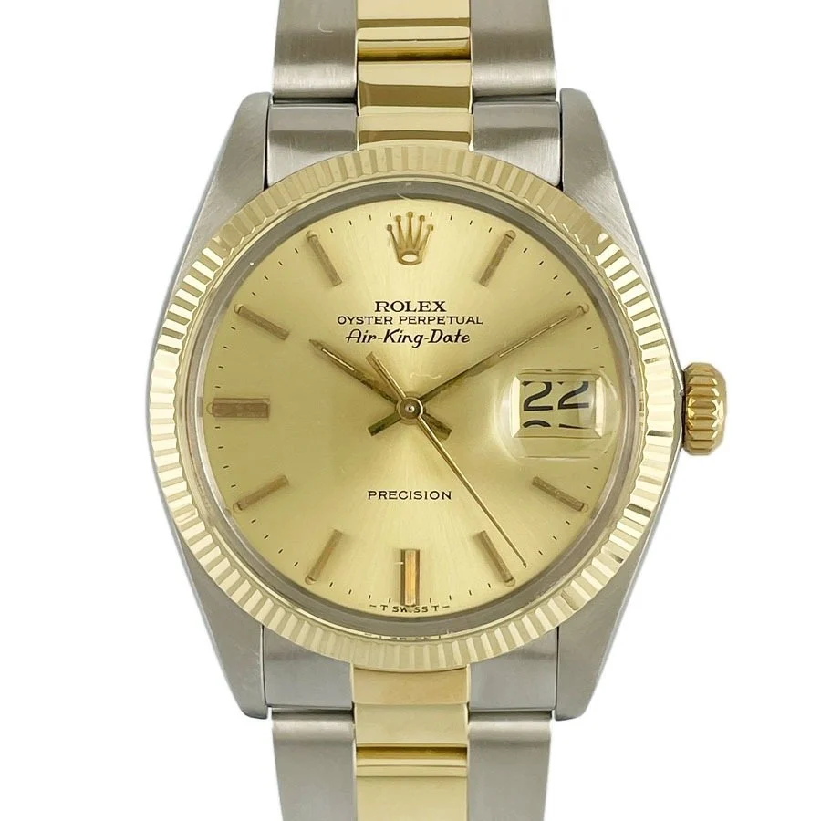 Gold and silver Rolex Air King 5701 Oyster Perpetual watch showing the date as the 22nd.