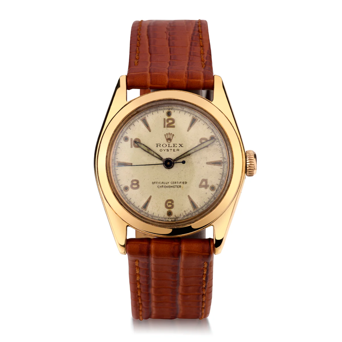 Gold Rolex Oyster 5020 watch with a brown leather strap and a white dial featuring Arabic numerals and markers.