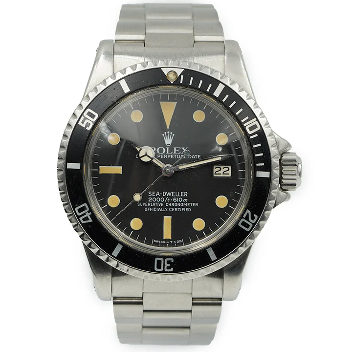 A vintage Rolex Sea-Dweller 1665 stainless steel watch featuring a black dial and date display.