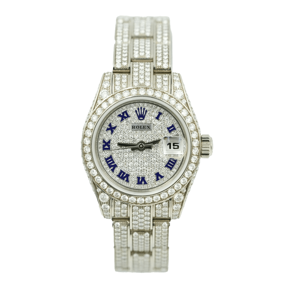 Silver Rolex Datejust watch encrusted with diamonds, featuring blue Roman numerals and a date window at three o’clock.