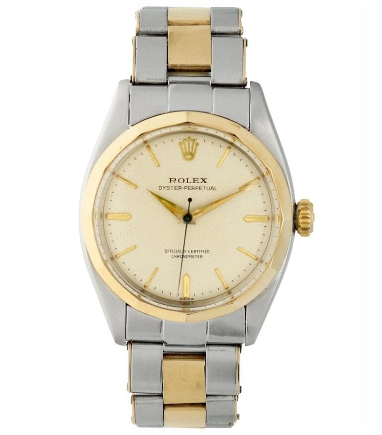 A silver and gold Rolex Oyster Perpetual 6586 wristwatch with a white dial and metal bracelet.