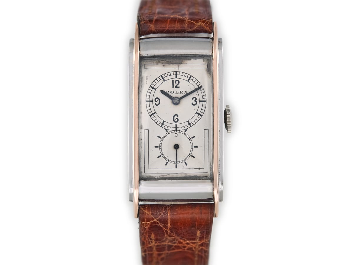 Rectangular vintage Rolex Prince with a brown leather strap and white dial displaying two subdials—a true luxury watch for discerning collectors.