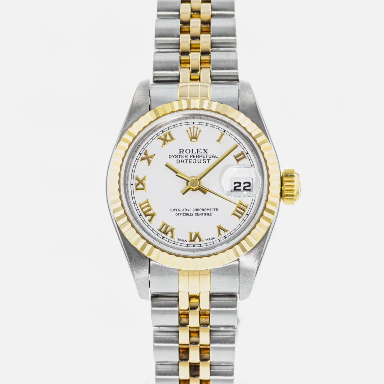 A Rolex Datejust 79173 watch with a two-tone metal band and a white dial displaying the date.