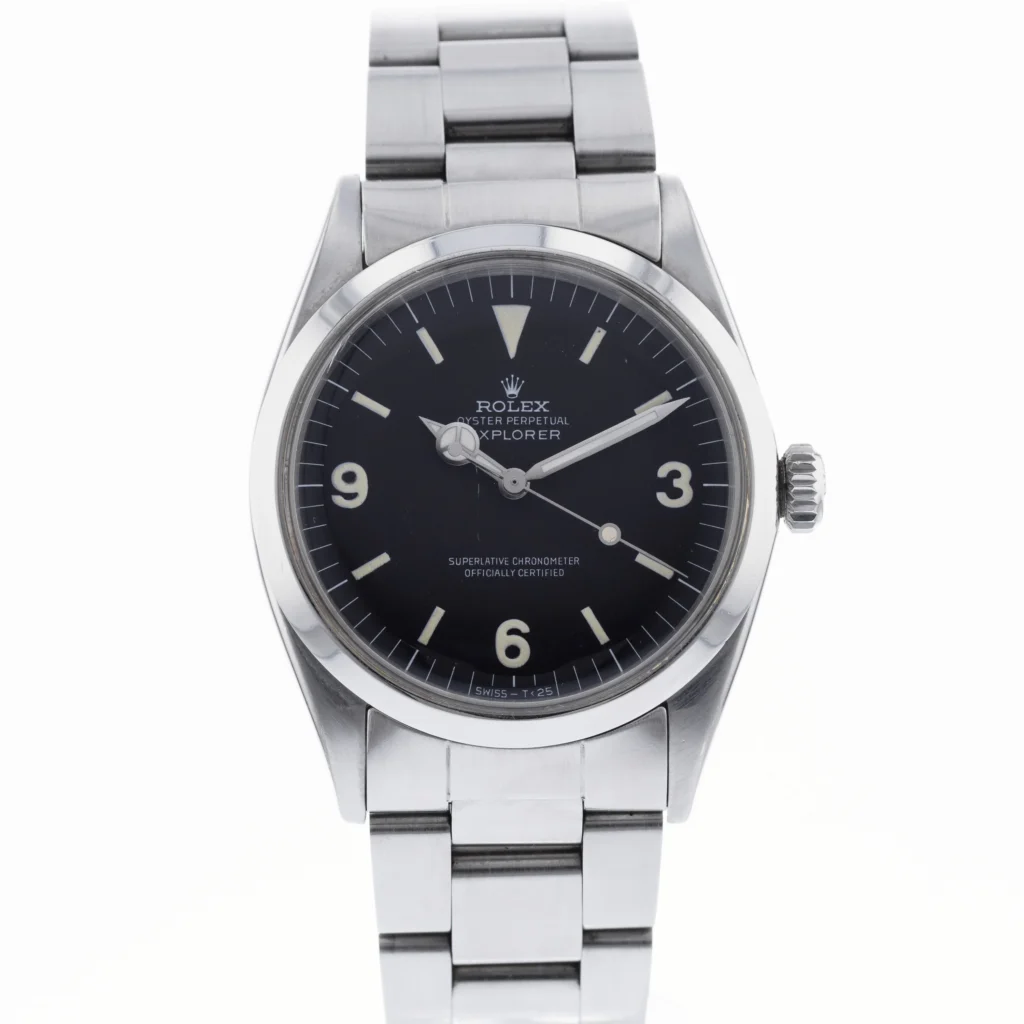 Stainless steel Rolex Explorer 1016 watch with a black dial and silver hour markers on a metal bracelet.