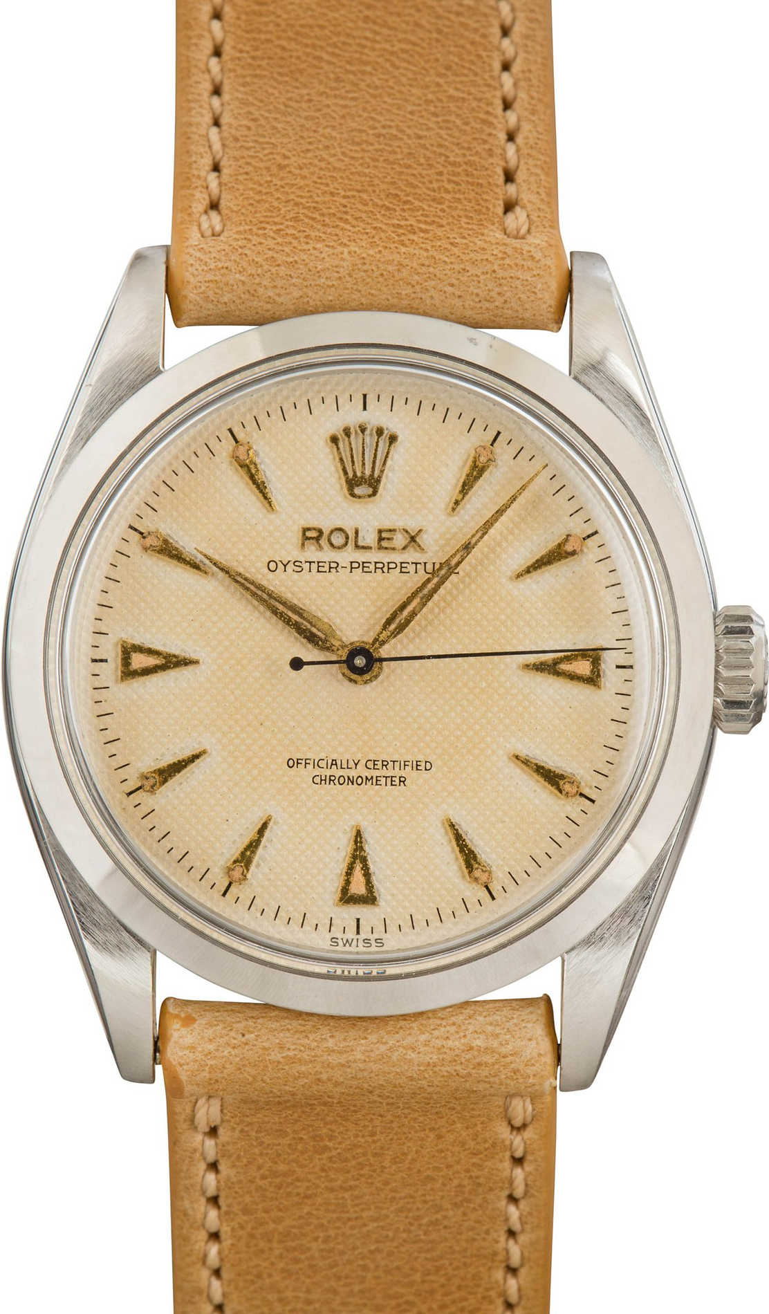 A vintage Rolex Oyster Perpetual 3708 watch featuring a beige dial and tan leather strap.
