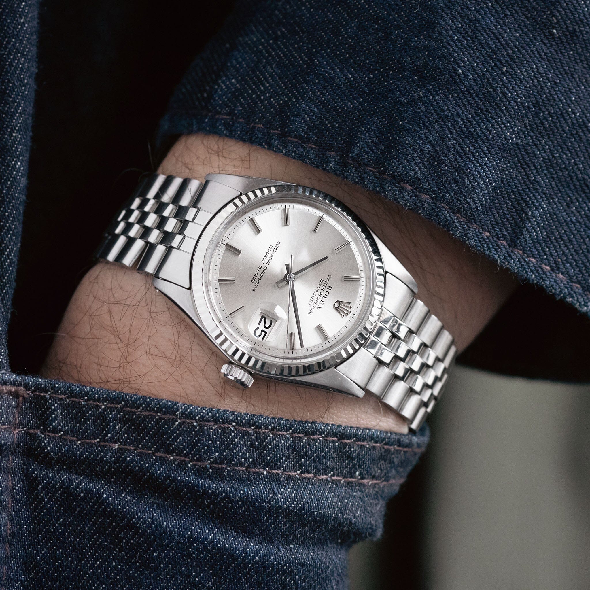 Complete Guide to the Rolex Datejust 1601 1 a silver Rolex datejust 1601 watch on a person's arm