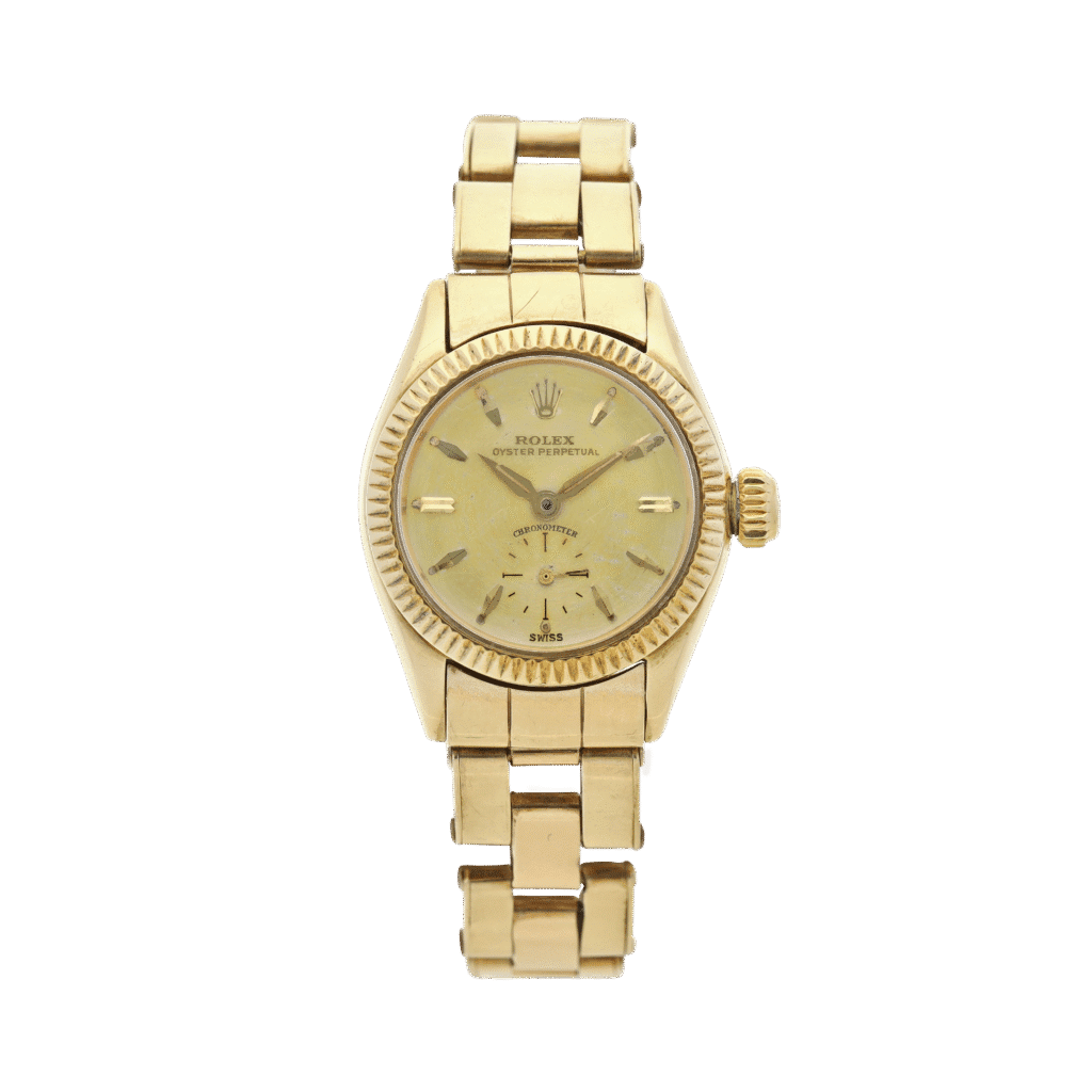 Gold Rolex Oyster Perpetual wristwatch, model 6509, featuring a metal link band and a round champagne-colored dial, shown on a plain background.