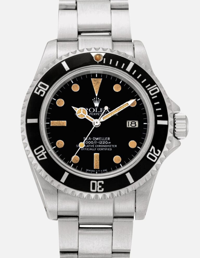 A vintage stainless steel Rolex Sea-Dweller 16660 watch featuring a black dial, date window, and rotating bezel.