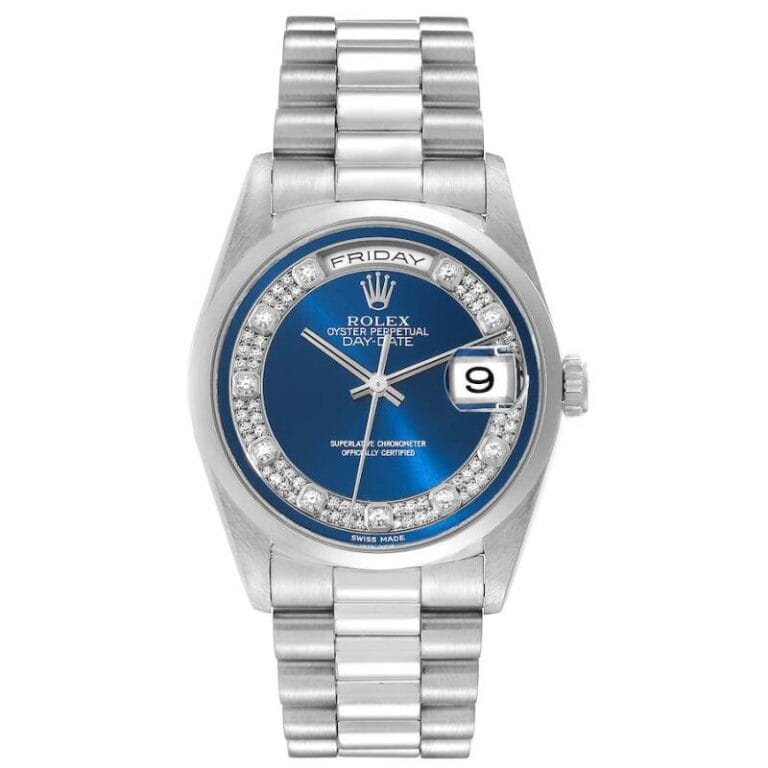 Silver Rolex President 18206 watch with a blue dial, diamond hour markers, and day and date display.