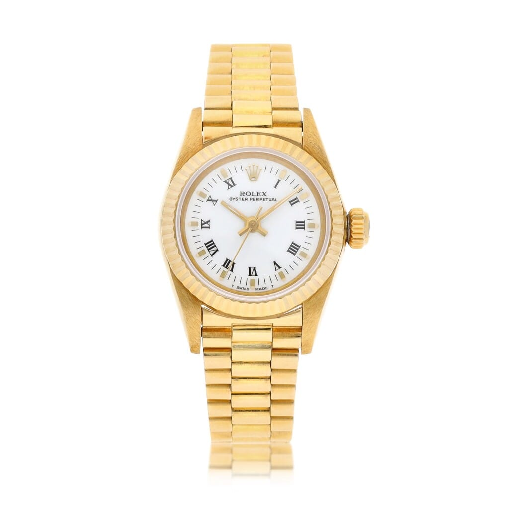 Gold Rolex Oyster Perpetual 67198 wristwatch with a white dial, Roman numeral markers, and a gold link bracelet, shown on a white background.