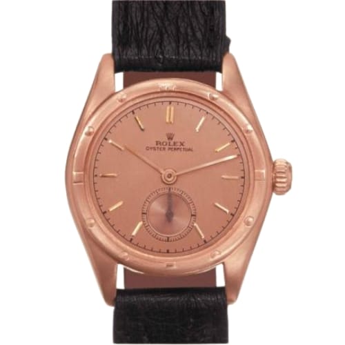 A vintage rose gold Rolex Oyster Perpetual wristwatch with a black leather strap and minimalist dial design.