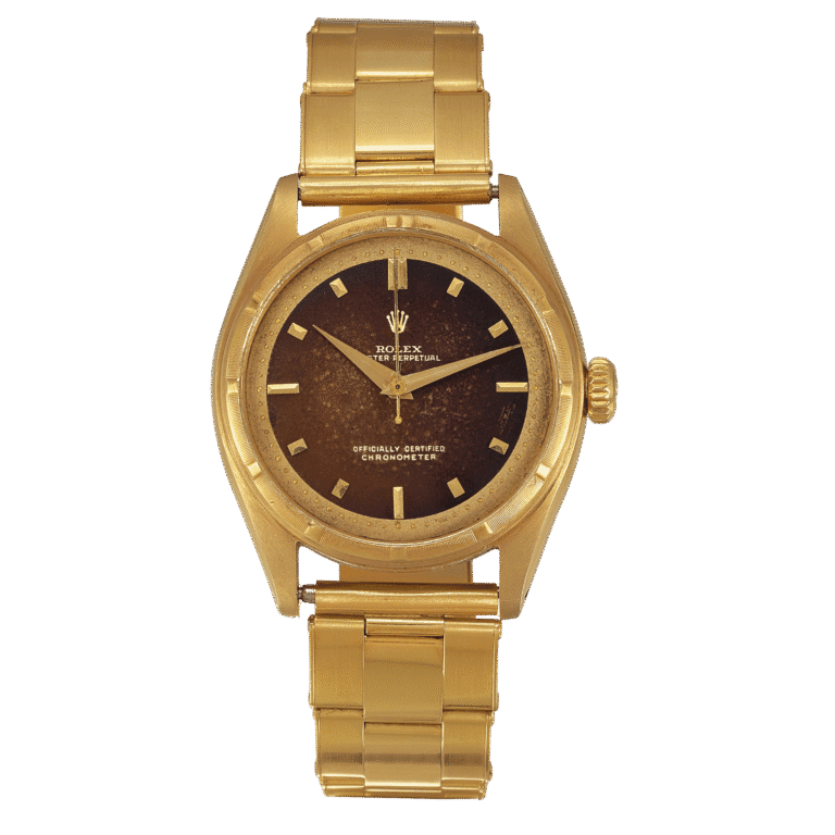 Gold Rolex Oyster Perpetual wristwatch, model 6101, with a dark, weathered face and gold hour markers, displayed on a plain background.