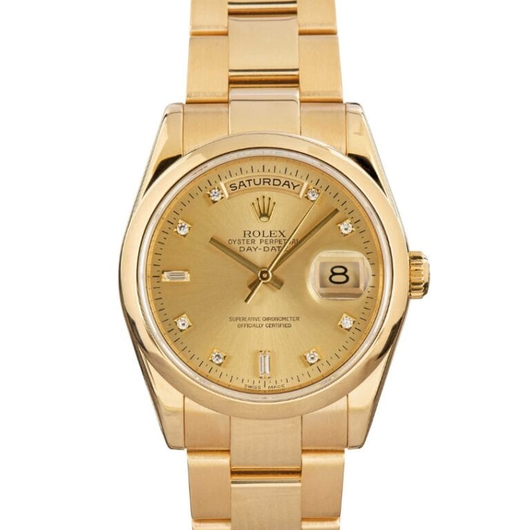 Gold Rolex Day-Date watch, also known as the Rolex President 118208, with diamond hour markers, showing Saturday and the date, on a gold bracelet.