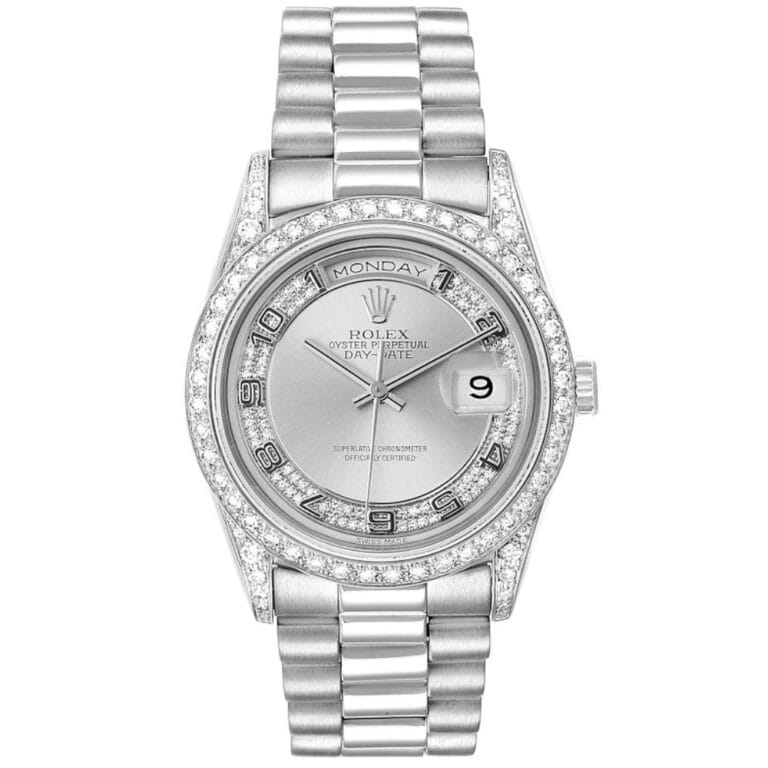 Silver Rolex President 18389 wristwatch with diamond accents, Arabic numerals, and a day-date display on a metal link band.
