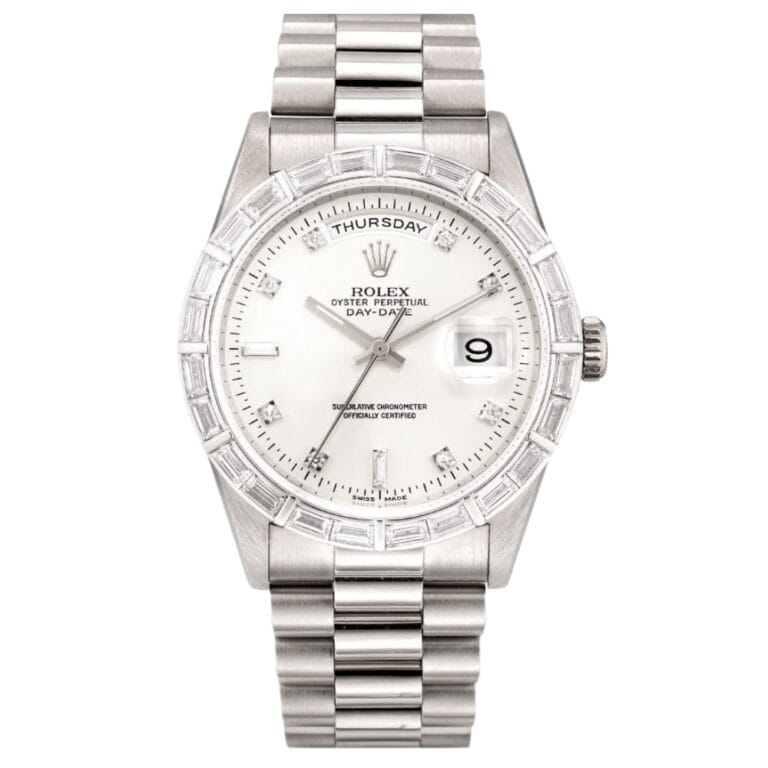 A silver Rolex Day-Date President 18369 watch with a white face, diamond bezel, metal band, and date and day displays.