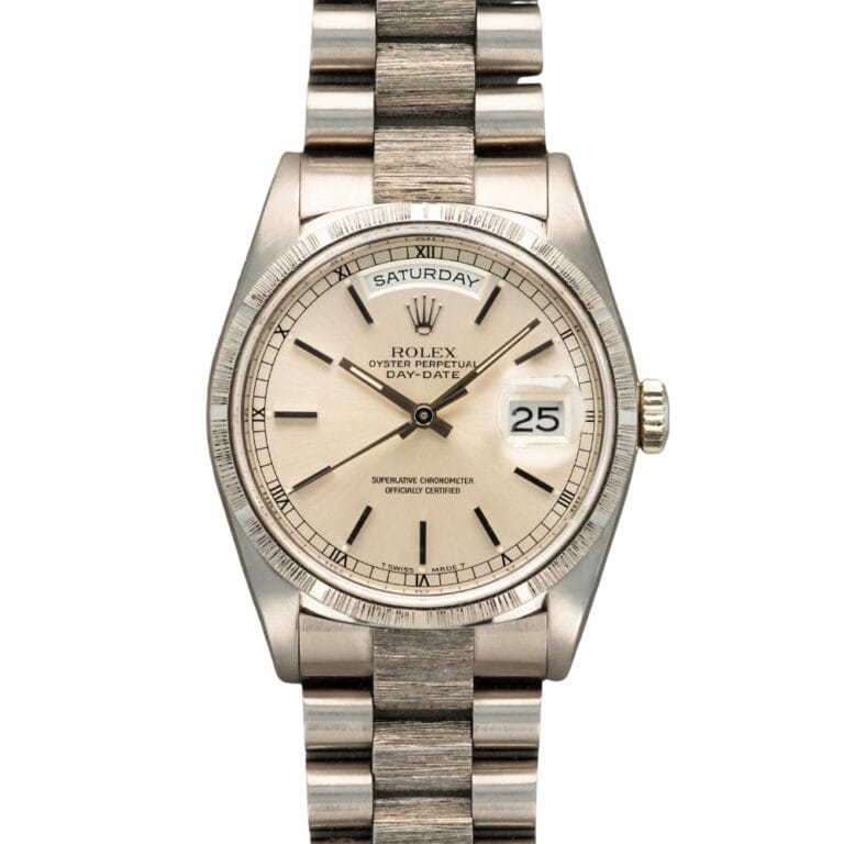 Silver Rolex Day-Date watch displaying the day Saturday and the date 25 on a white dial, complemented by a classic metal bracelet—an elegant choice from the renowned Rolex President collection.