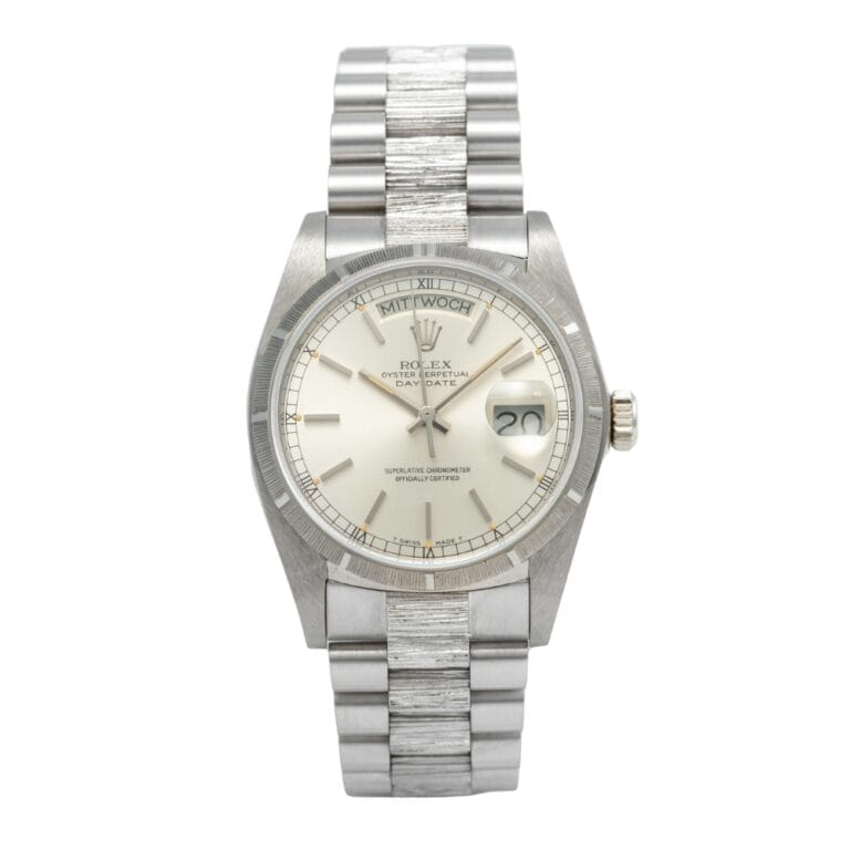 A silver Rolex Day-Date President 18079 wristwatch with a date window and metallic link bracelet, displayed on a white background.