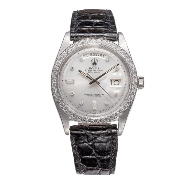 Silver Rolex Day-Date watch with diamond bezel, white dial, and a black crocodile leather strap, displaying day and date—a classic President 6613 timepiece.