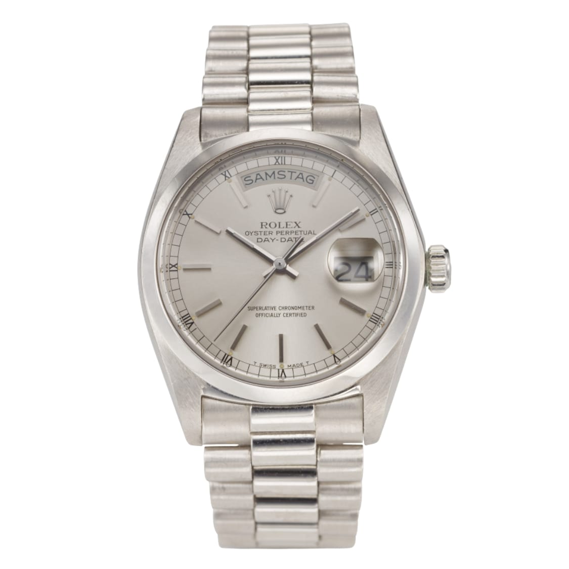 A silver Rolex Day-Date President 18026 wristwatch displaying the day SAMSTAG and the date 24 on a silver dial.