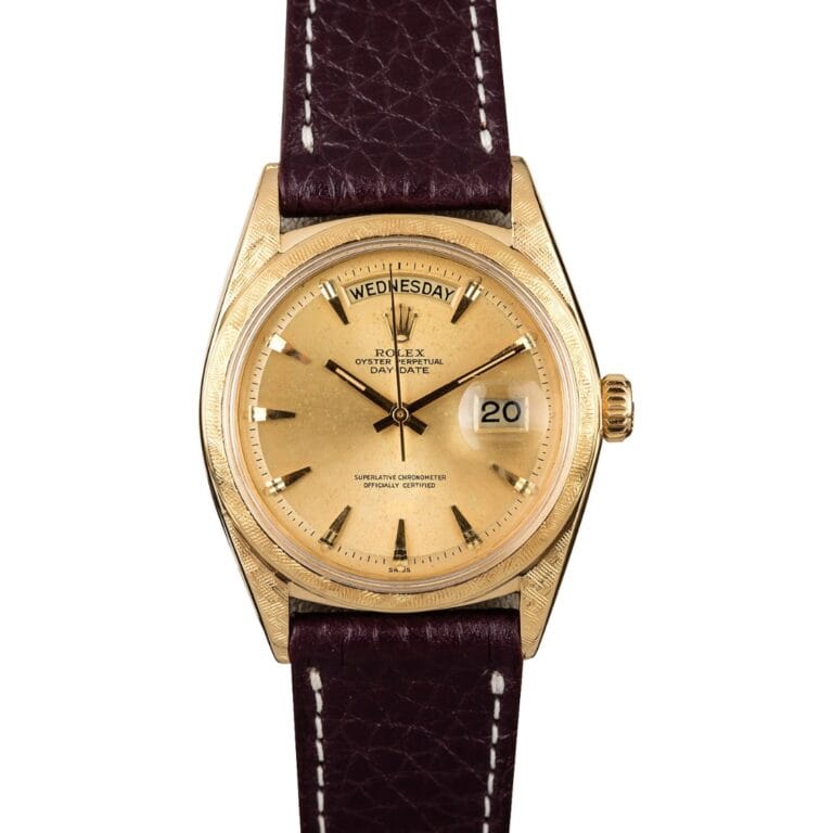 Gold Rolex Day-Date President watch with a brown leather strap, showing Wednesday and the 20th on its dial.