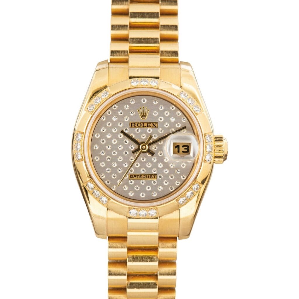 Gold Rolex Datejust watch with a diamond-studded face, date display, and gold link bracelet. Model: Rolex 179368.