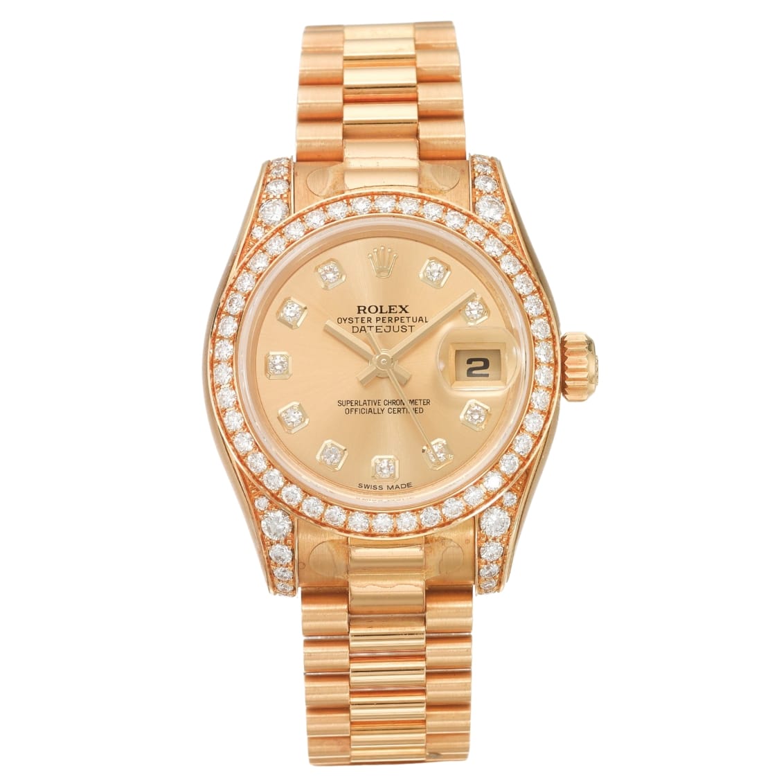A gold Rolex Datejust watch with a diamond-encrusted bezel and hour markers, displaying the date at 3 o’clock.