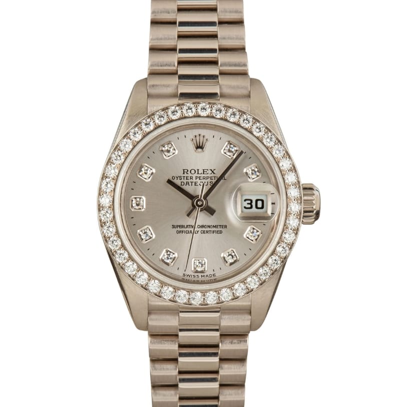 Silver Rolex Datejust 79179 watch with diamond hour markers and a diamond bezel, featuring a date display at 3 o’clock.
