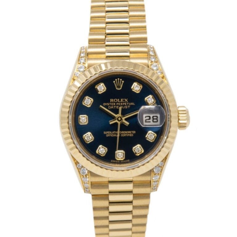 Gold Rolex Datejust 79238 watch featuring a blue dial, diamond hour markers, date window, and sparkling diamond accents.