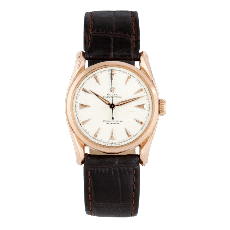 A classic Rolex Oyster Perpetual 6018 wristwatch with a brown leather strap and a white dial displaying gold hour markers.