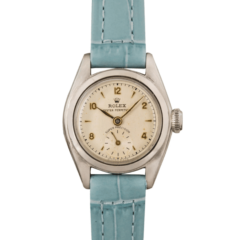 Vintage Rolex Oyster Perpetual 4486 wristwatch with a light blue leather strap and a round, cream-colored dial.