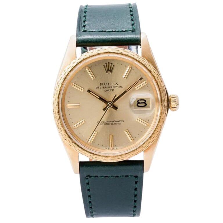 Gold Rolex Oyster Perpetual Date 1514 watch featuring a green leather strap and a date display at 3 o’clock.
