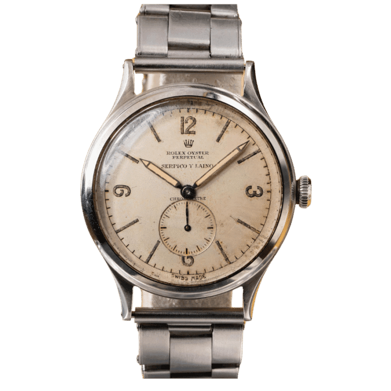 A vintage Rolex Oyster Perpetual stainless steel wristwatch with a round face and metal band, showing the time 4:57.