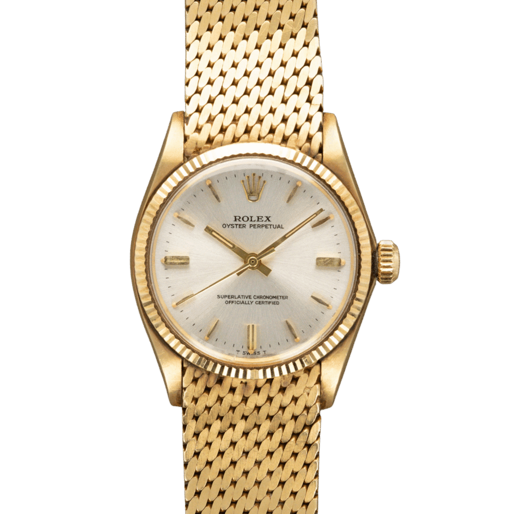 A gold Rolex Oyster Perpetual 6551 wristwatch with a mesh bracelet and silver dial displayed on a plain background.