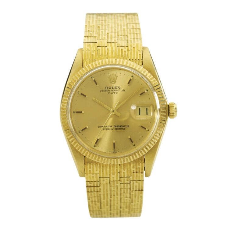 Gold Rolex Oyster Perpetual Date 1509 wristwatch featuring a textured gold band and a date display on the right side of the dial.