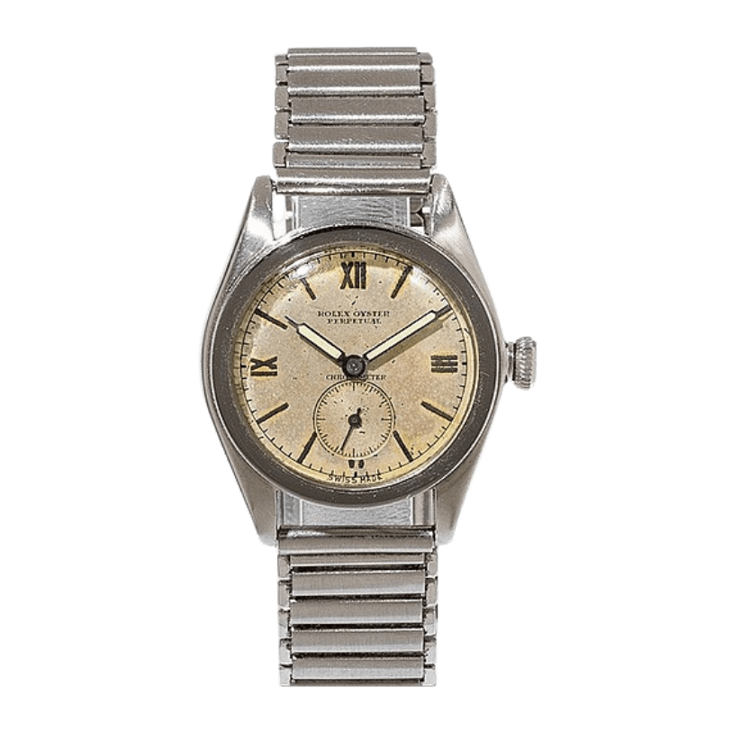 A vintage Rolex Oyster Perpetual 3772 watch with a metal band and cream-colored dial.