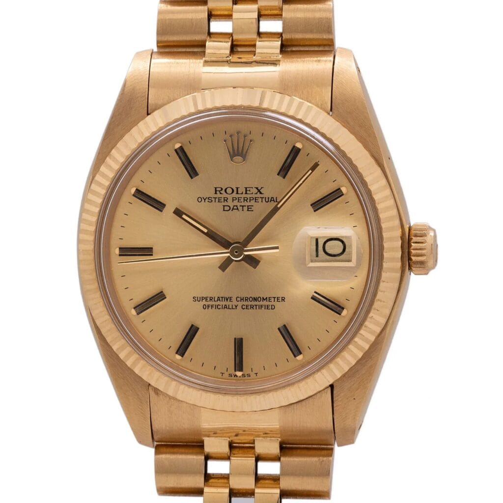 Gold Rolex Oyster Perpetual Date 1508 watch featuring a champagne dial and a date window at 3 o’clock.