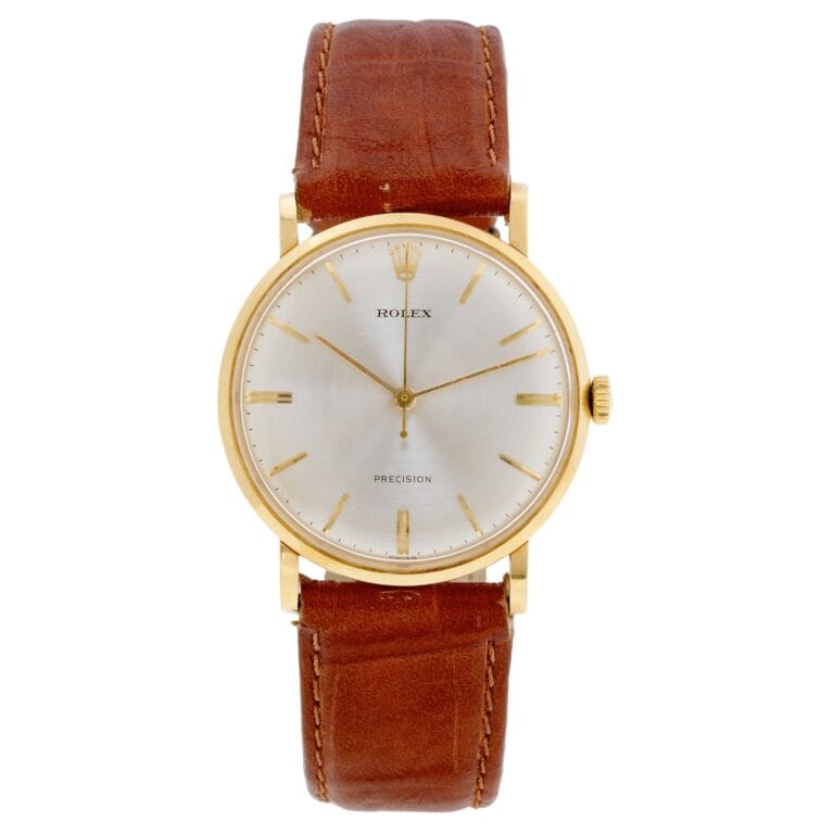 Gold Rolex Precision watch with a white dial and brown leather strap, featuring simple hour markers and two hands—a classic vintage watch for timeless elegance.