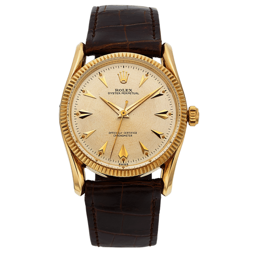 Gold Rolex Oyster Perpetual watch with a brown leather strap and cream dial, displaying the time 10:10.