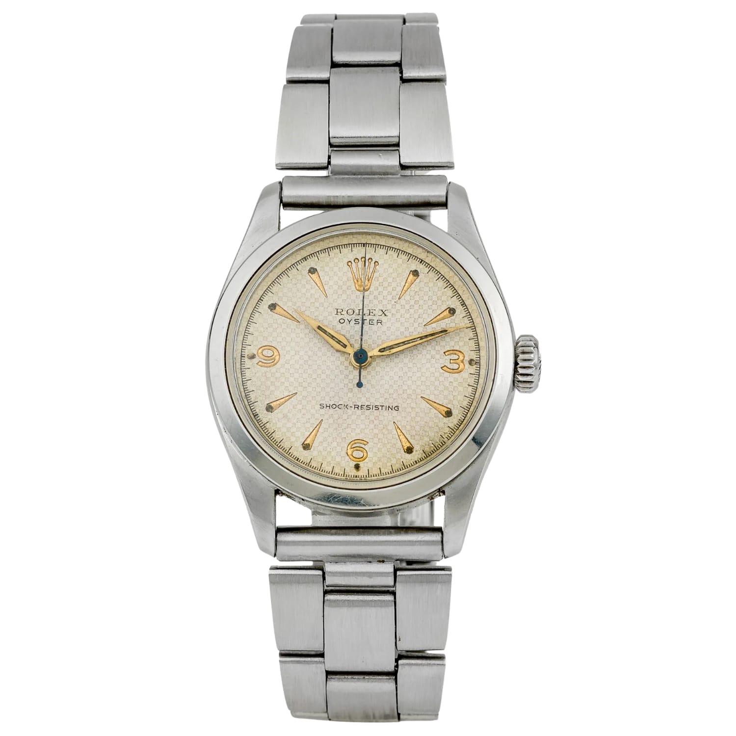 A vintage Rolex Oyster wristwatch with a stainless steel band and a cream-colored dial, this classic timepiece embodies the timeless elegance of the iconic Rolex 6244 model.