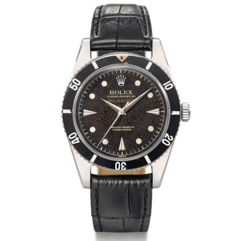 A vintage Rolex Oyster Perpetual Milgauss 6543 watch with a black dial, black bezel, and black leather strap.