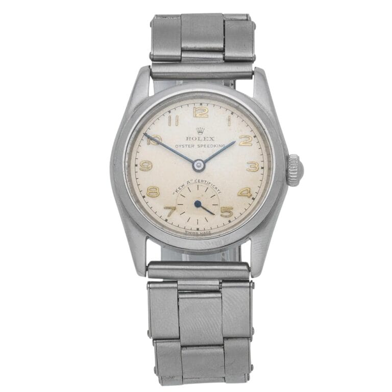 Vintage Rolex Oyster Speedking 5056 watch with a silver metal band and off-white dial displaying Arabic numerals.