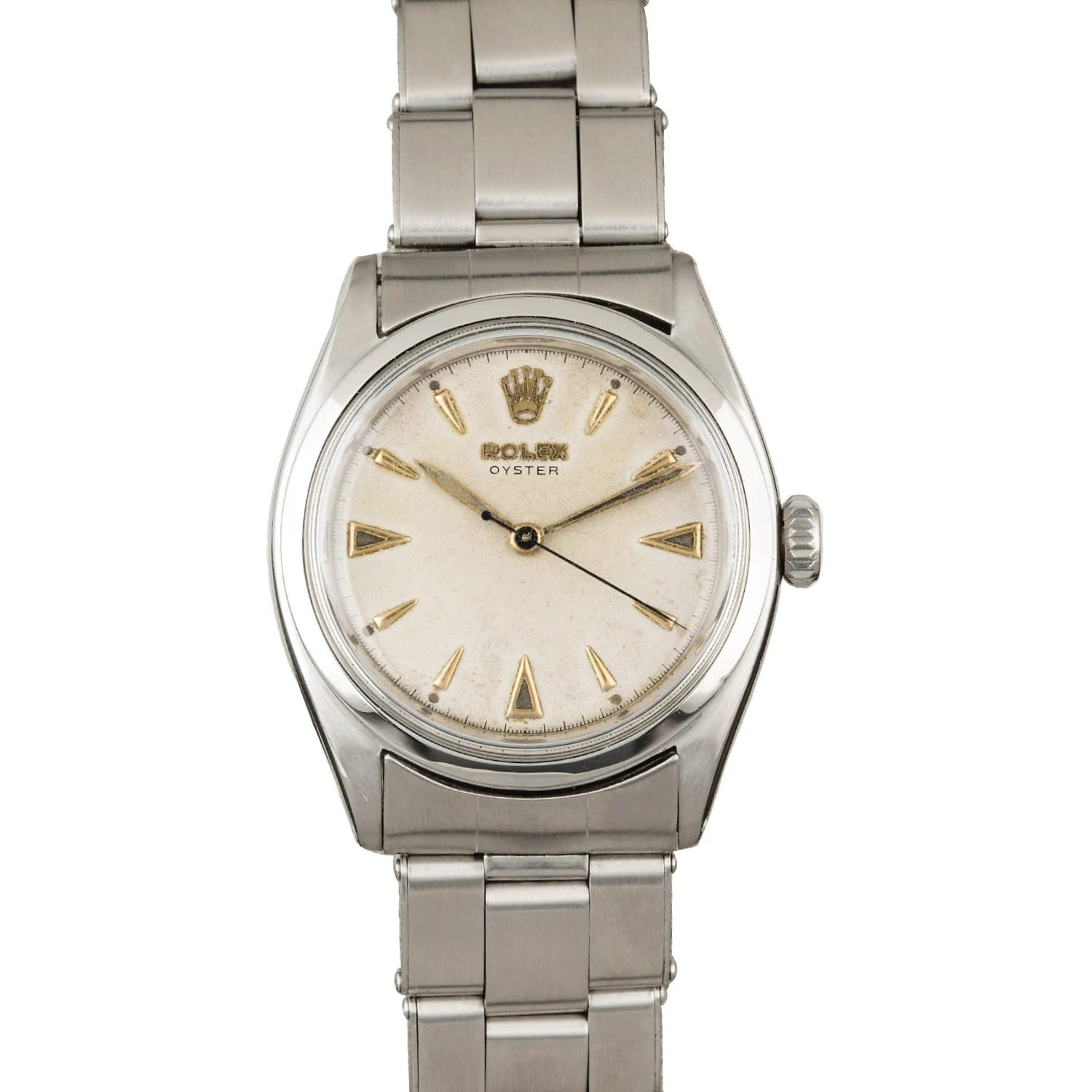 A vintage Rolex Oyster 6022 wristwatch with a silver metal band and a white dial featuring gold hour markers.