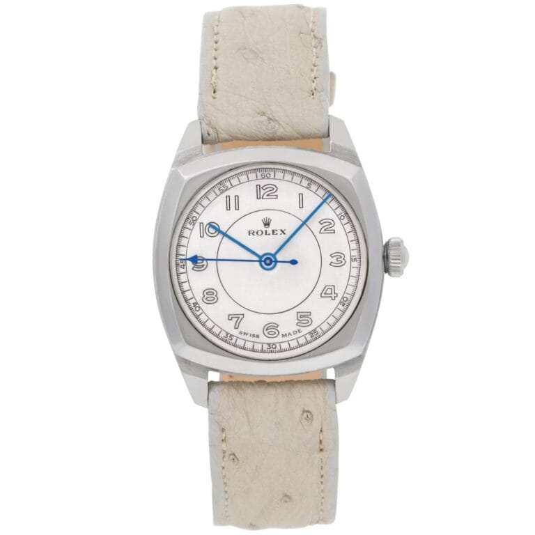 A Rolex Oyster wristwatch featuring a silver case, white dial, blue hands, and a light beige leather strap.