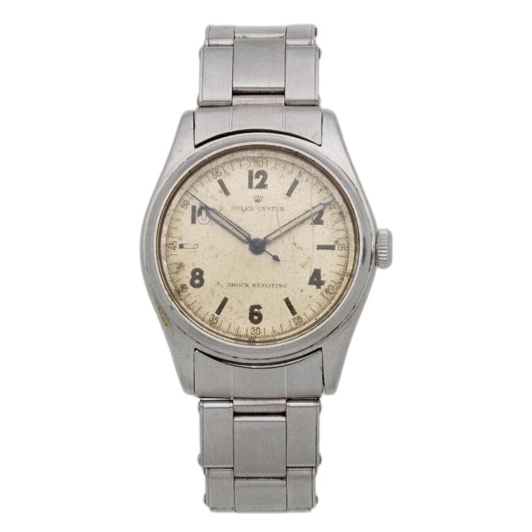 A vintage stainless steel Rolex Oyster 4444 wristwatch with a cream-colored dial and black numerals.