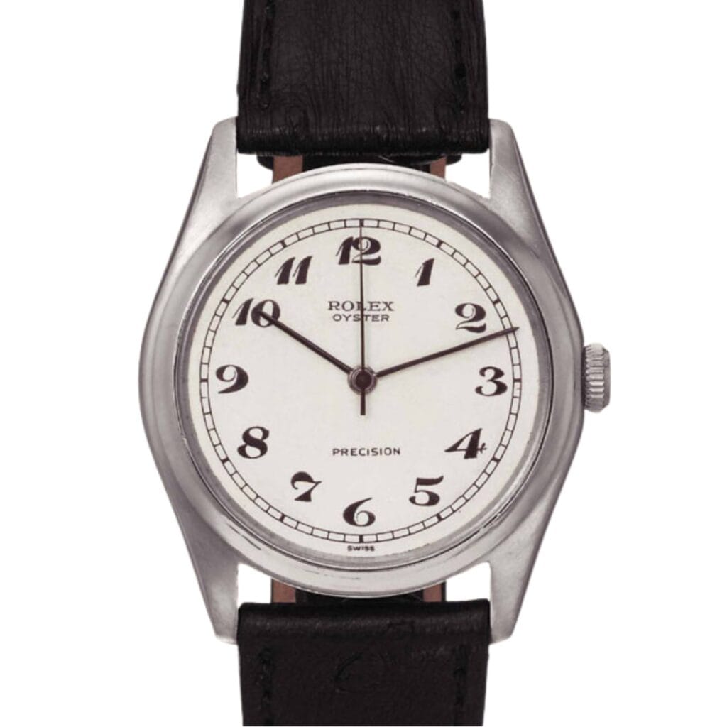 A silver Rolex Oyster Precision watch, reference Rolex 4461, with a white dial, Arabic numerals, and a black leather strap.