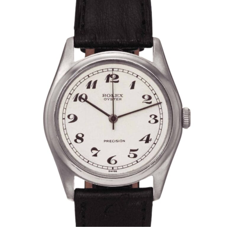 A silver Rolex Oyster Precision watch, reference Rolex 4461, with a white dial, Arabic numerals, and a black leather strap.