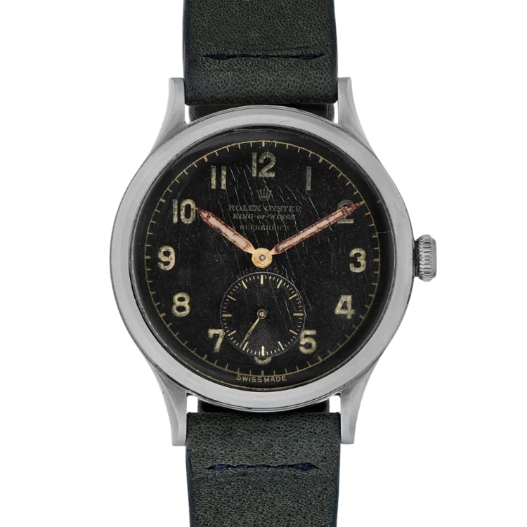 A vintage Rolex Oyster military-style wristwatch with a black dial, gold numerals, and a black leather strap.