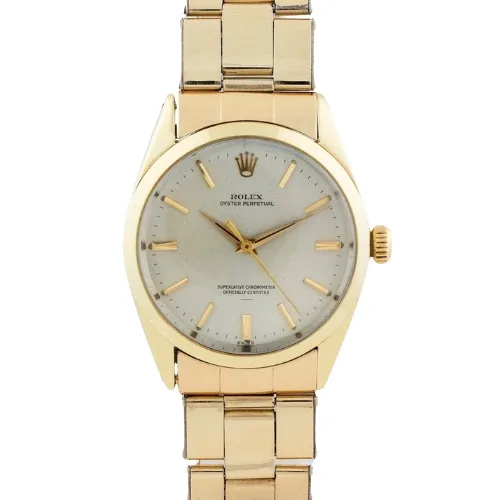 Gold Rolex Oyster Perpetual wristwatch with a white dial and gold hour markers on a gold bracelet, model 1024.