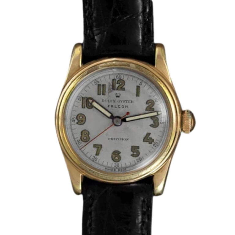 A gold Rolex Oyster 4070 Falcon wristwatch with a black leather strap and bold numbers on a white dial.