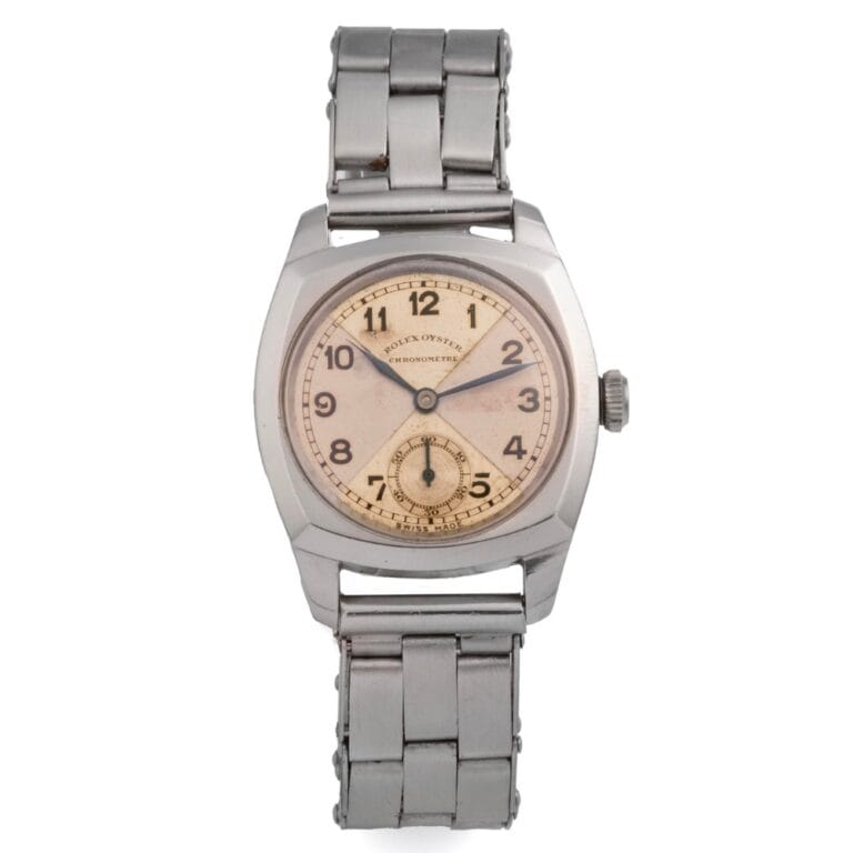 A vintage Rolex watch with a cream dial, black numerals, and a classic metal link band—timeless style inspired by the renowned Oyster 3139.